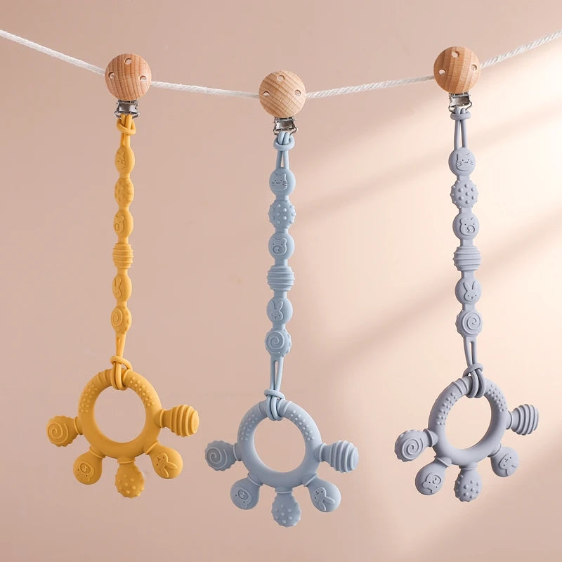 Pacifier clip with teething ring