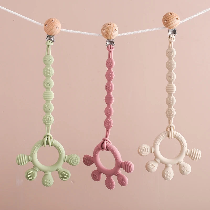Pacifier clip with teething ring