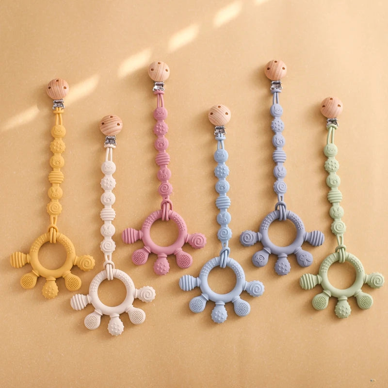 Pacifier clip with teething ring